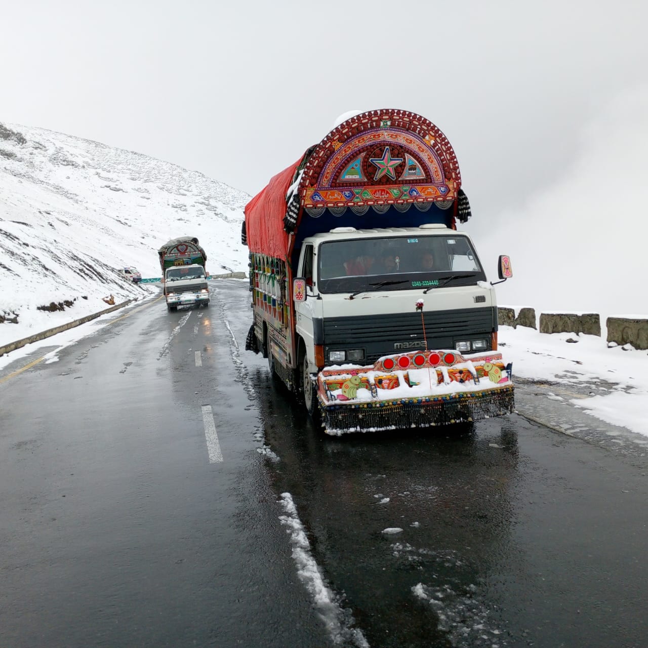 Insaaf Logistics professional moving team with Mazda truck in Islamabad